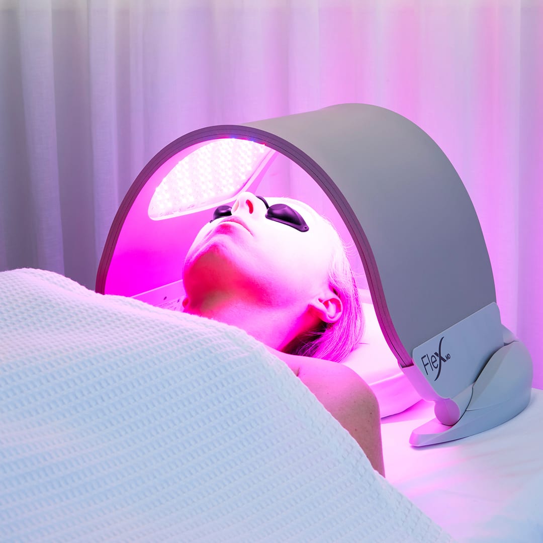 Client relaxing during a Dermalux LED Light Therapy treatment