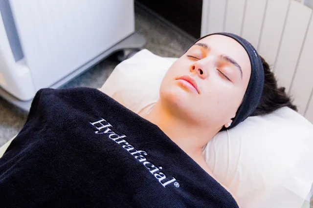 Client relaxing during a HydraFacial MediFacial skin treatment