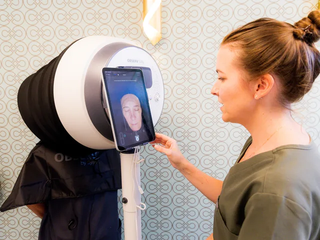 Practitioner scanning a patient with the Observ 520x Skin Analysis System
