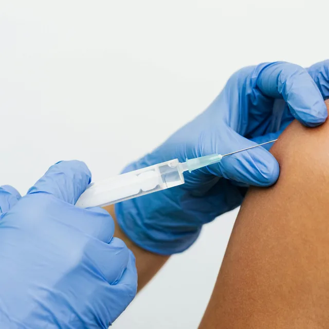 Vitamin injection being administered by a medical practitioner
